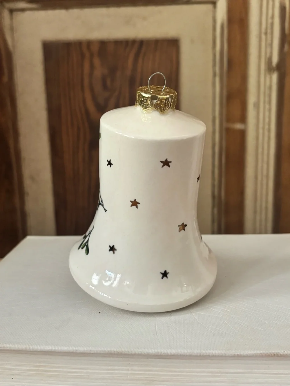 White Ceramic Bell Ornament with Pink Angel Figurines